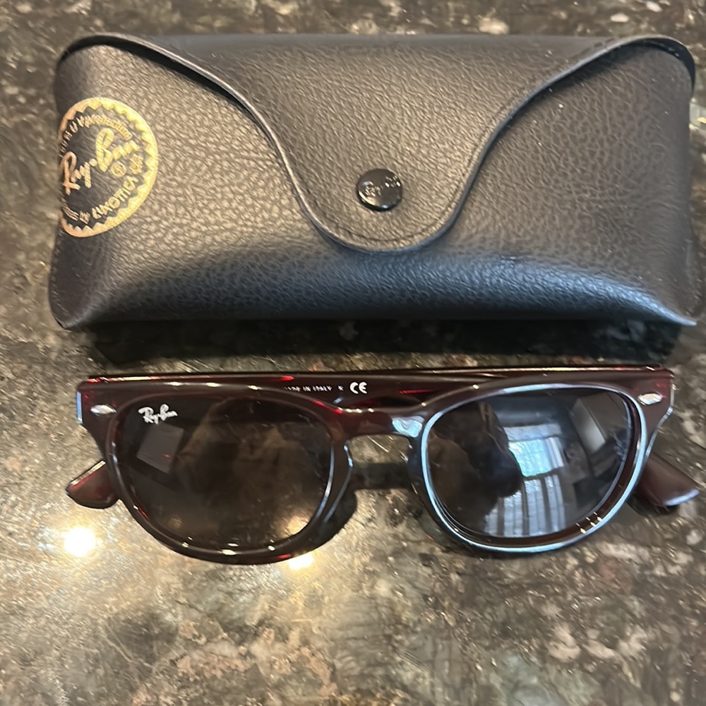 Ray bans sunglasses- reddish / brown color . Percent condition . Never worn